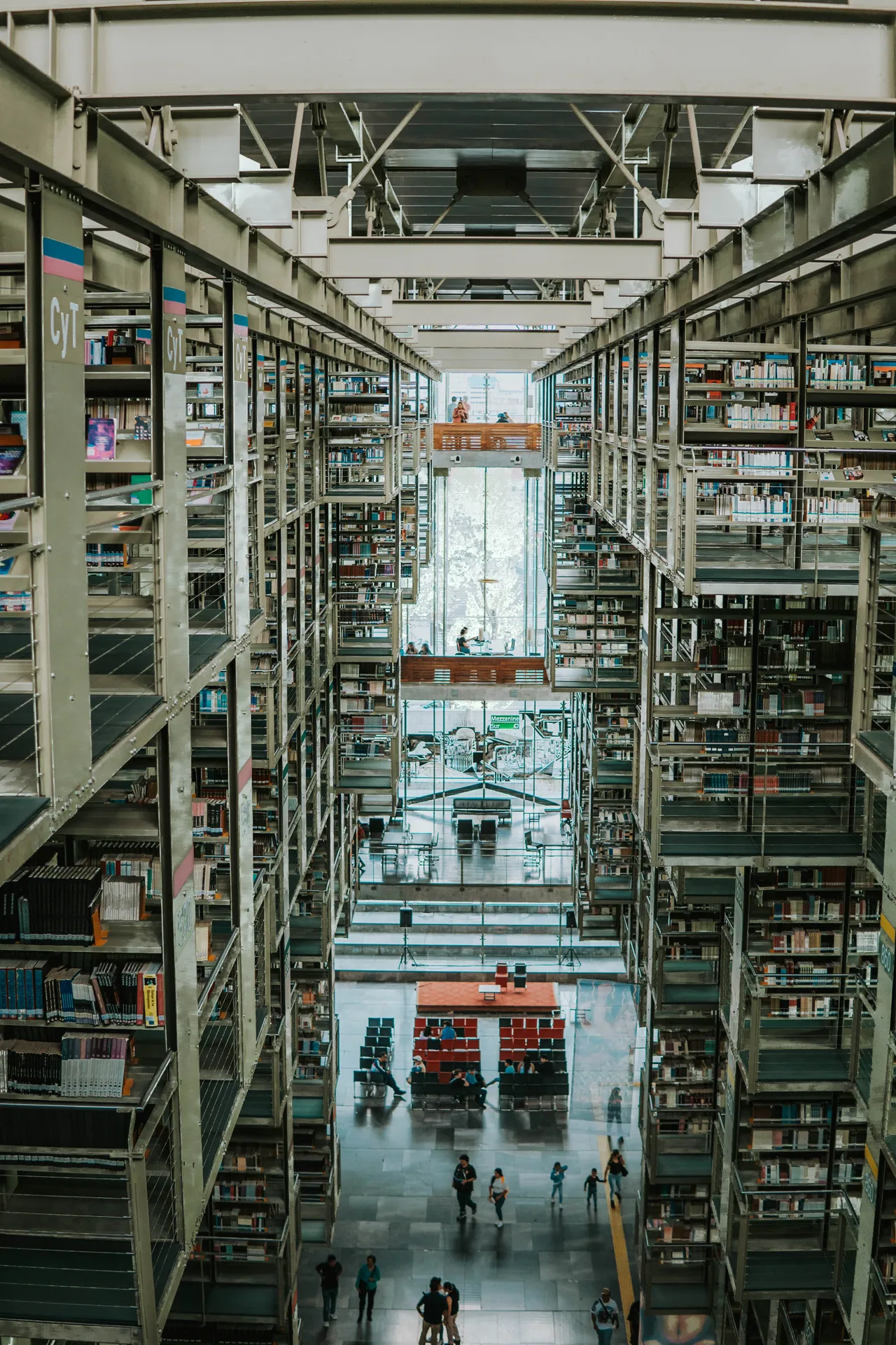 Towering bookshelves inside Biblioteca Vasconcelos looking down the central corridor