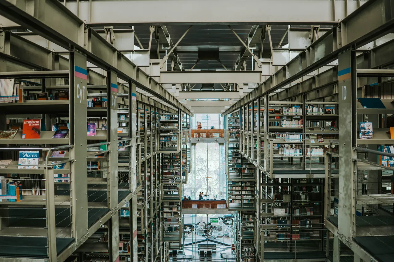 Multi-story bookshelves and walkways inside Biblioteca Vasconcelos