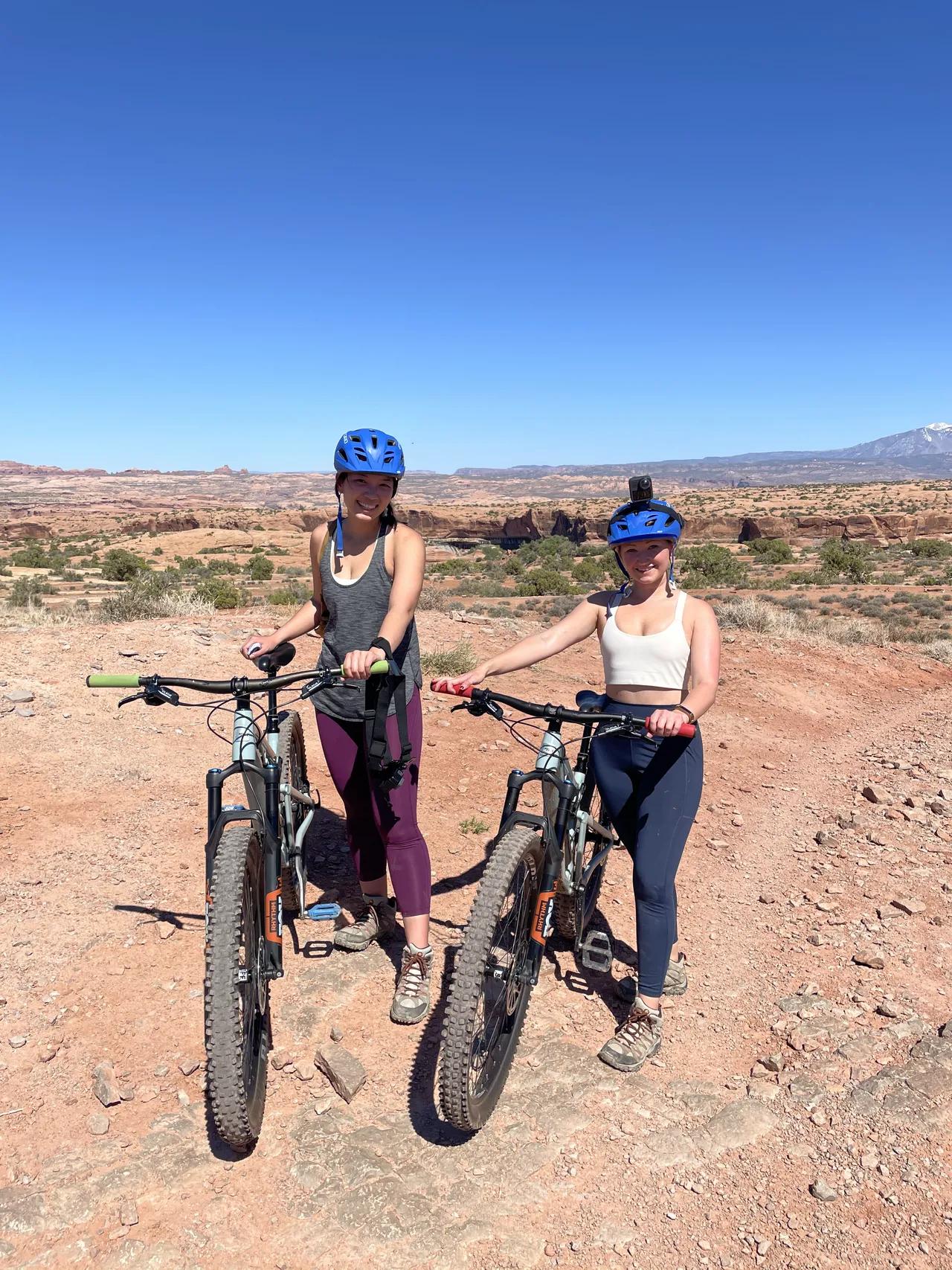 two girls mountainbiking in moab