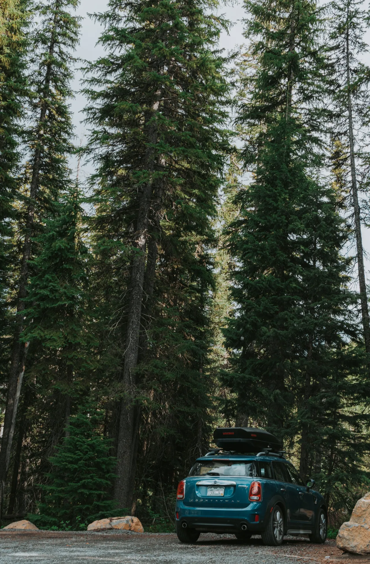 mini cooper countryman with cargo box parked at trailhead