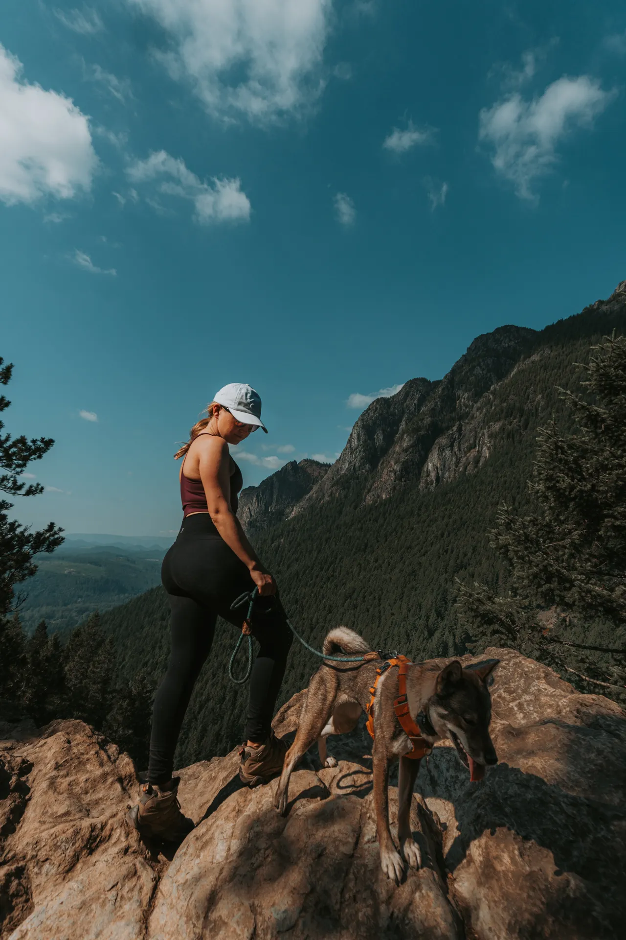 a girl and her dog at little si hiking trail summit