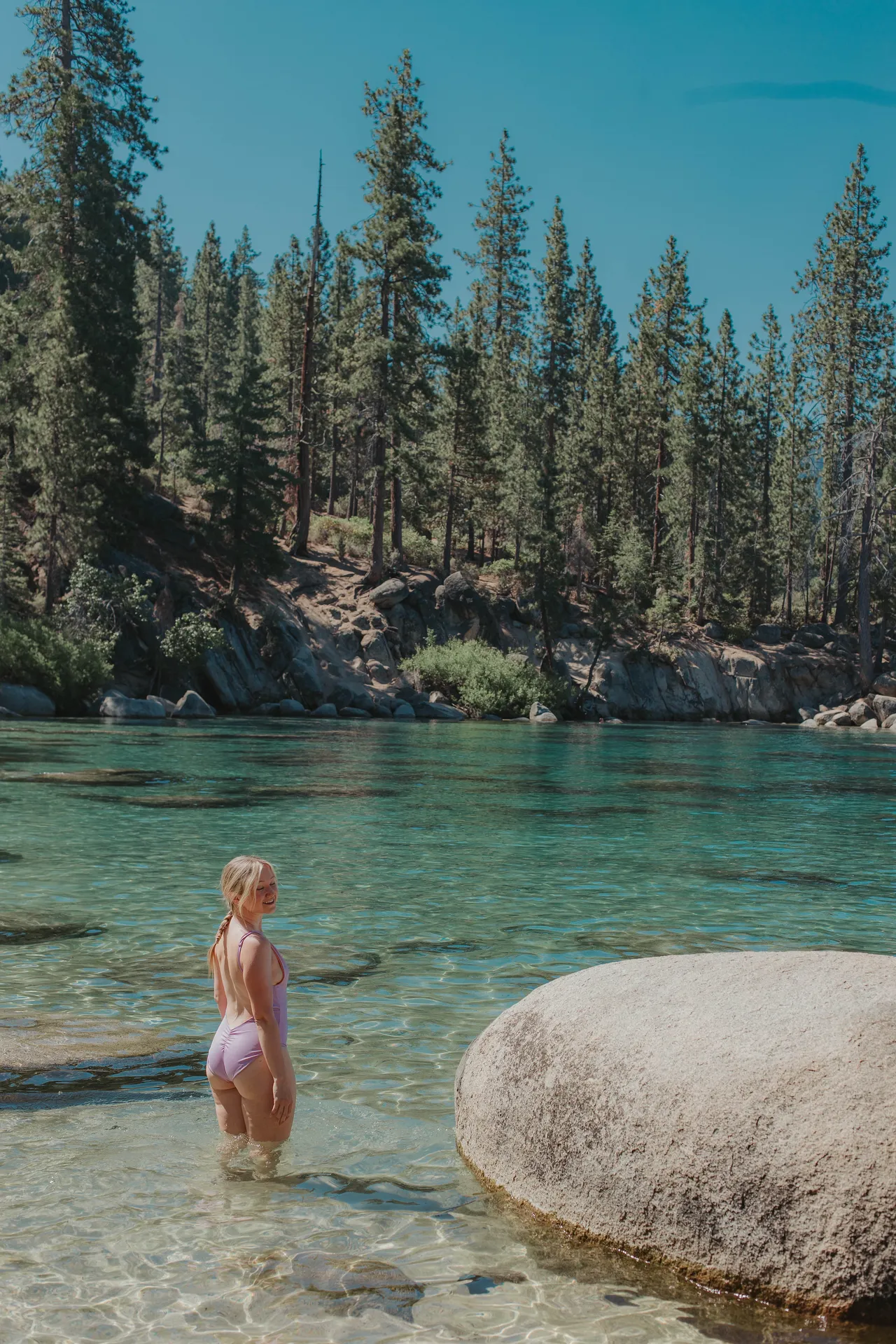 a girl at secret cove beach in lake tahoe