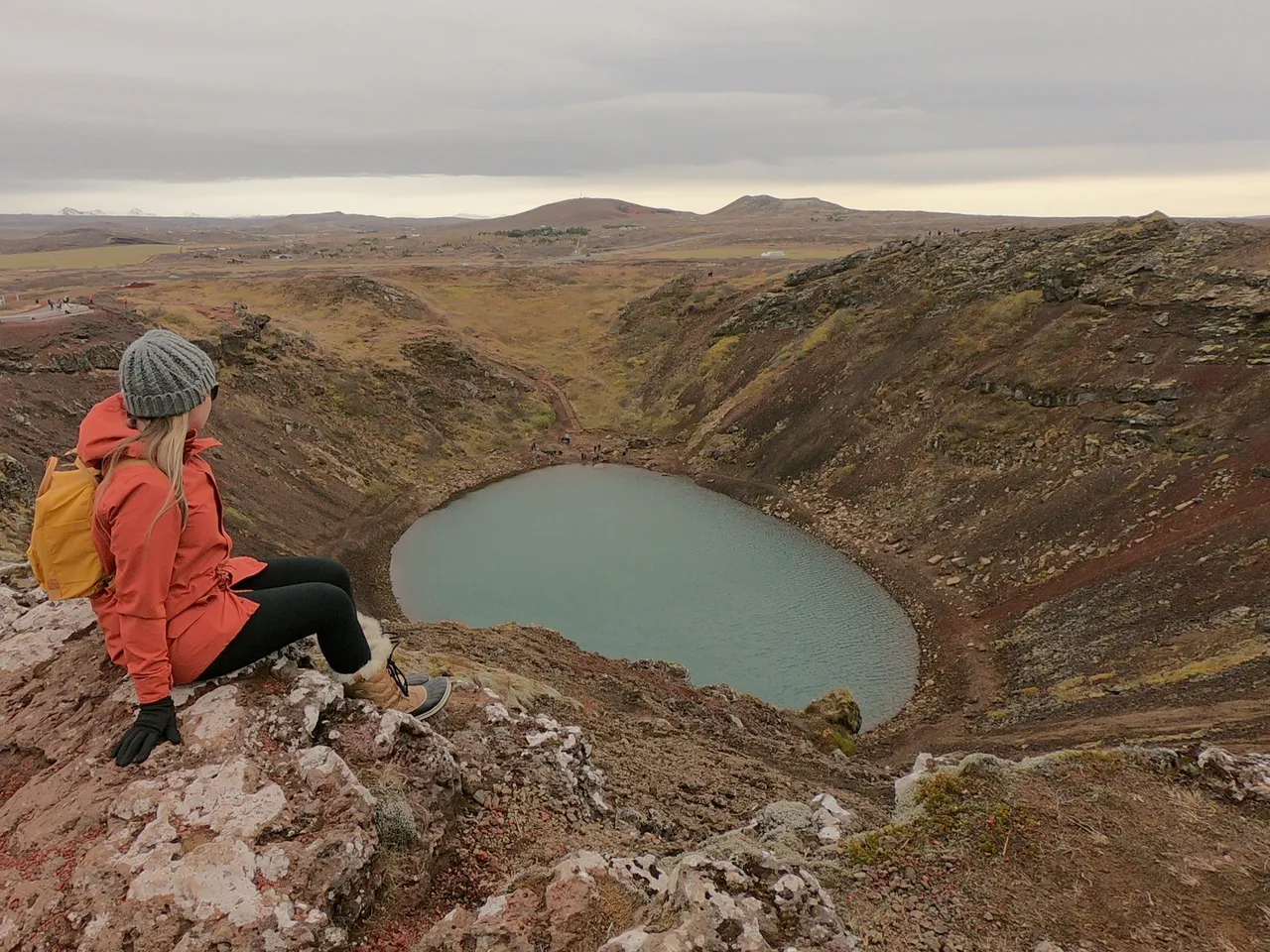 a girl staring out at kerid crater
