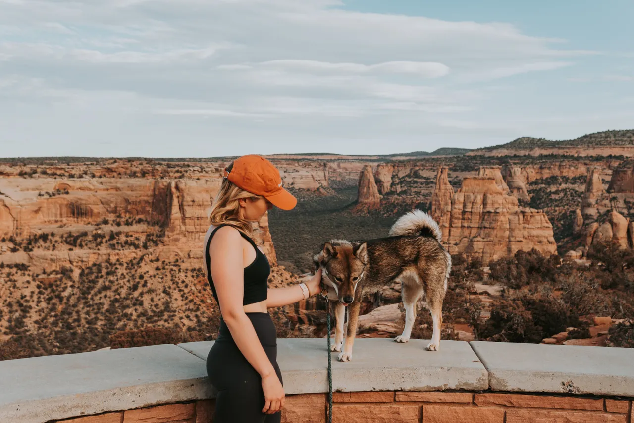a girl and her dog at colorado national monument
