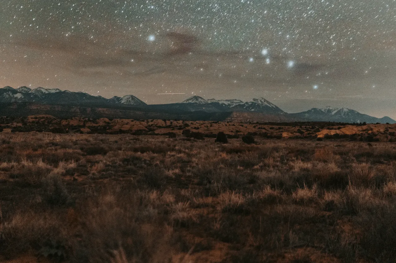 starry night above the la sal mountain range at the sand flats campground