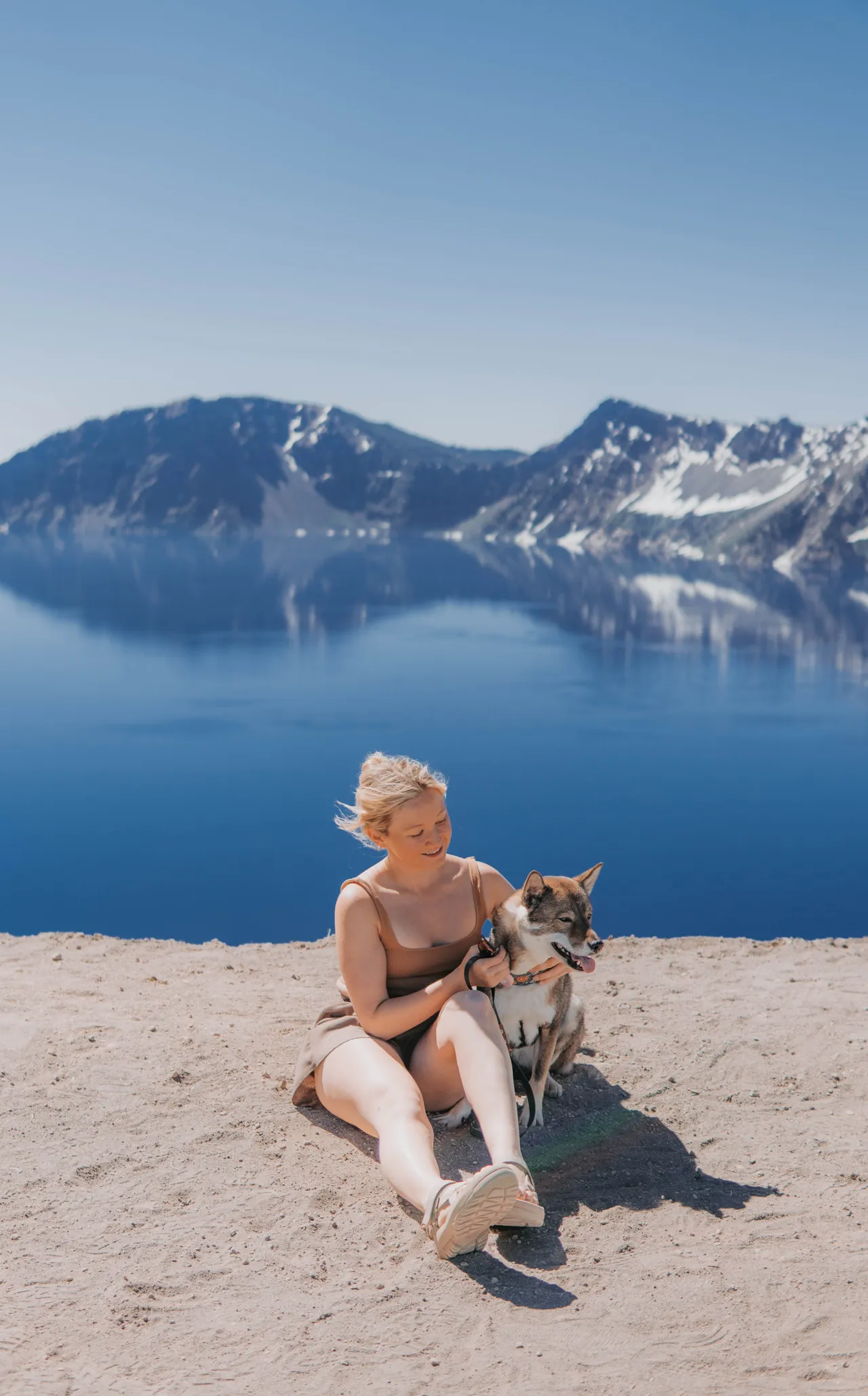 Sitting with Sora on the rim of Crater Lake National Park, Oregon