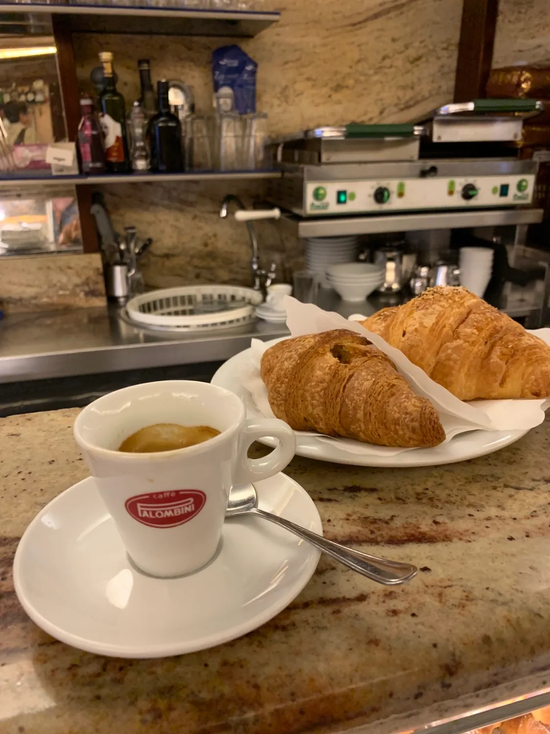 espresso and croissant in roma