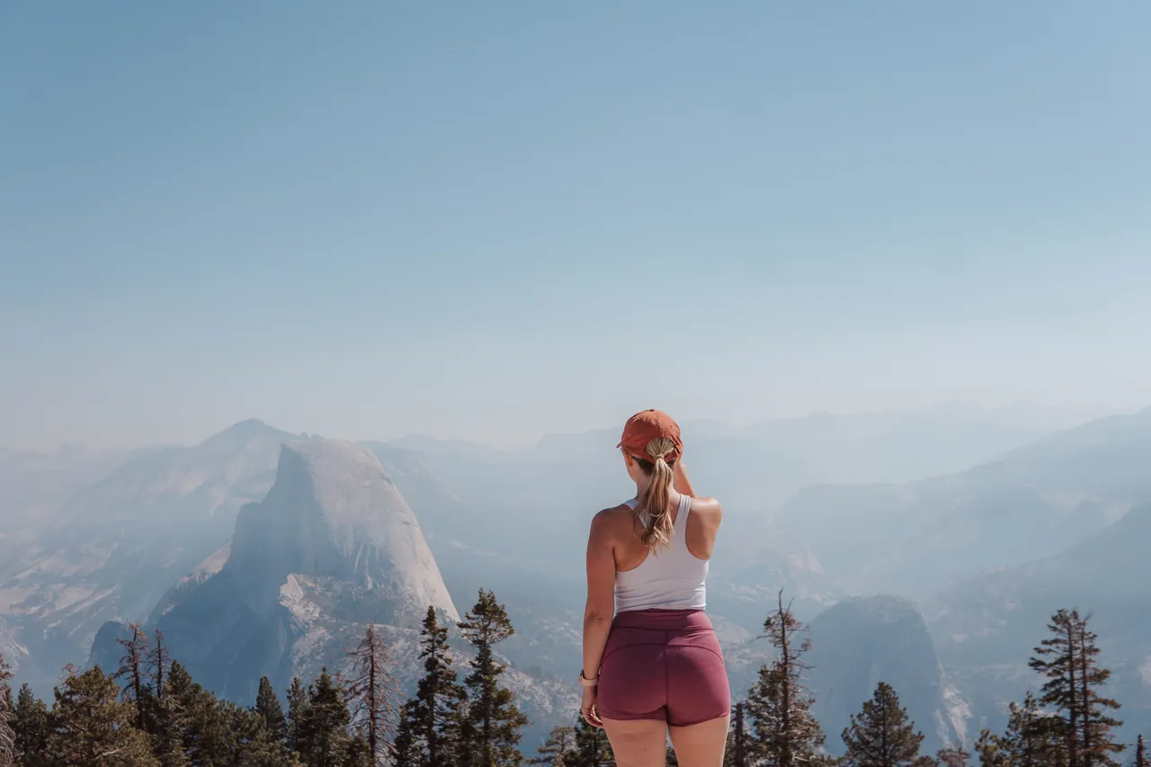 Standing on Sentinel Dome with Half Dome in the distance