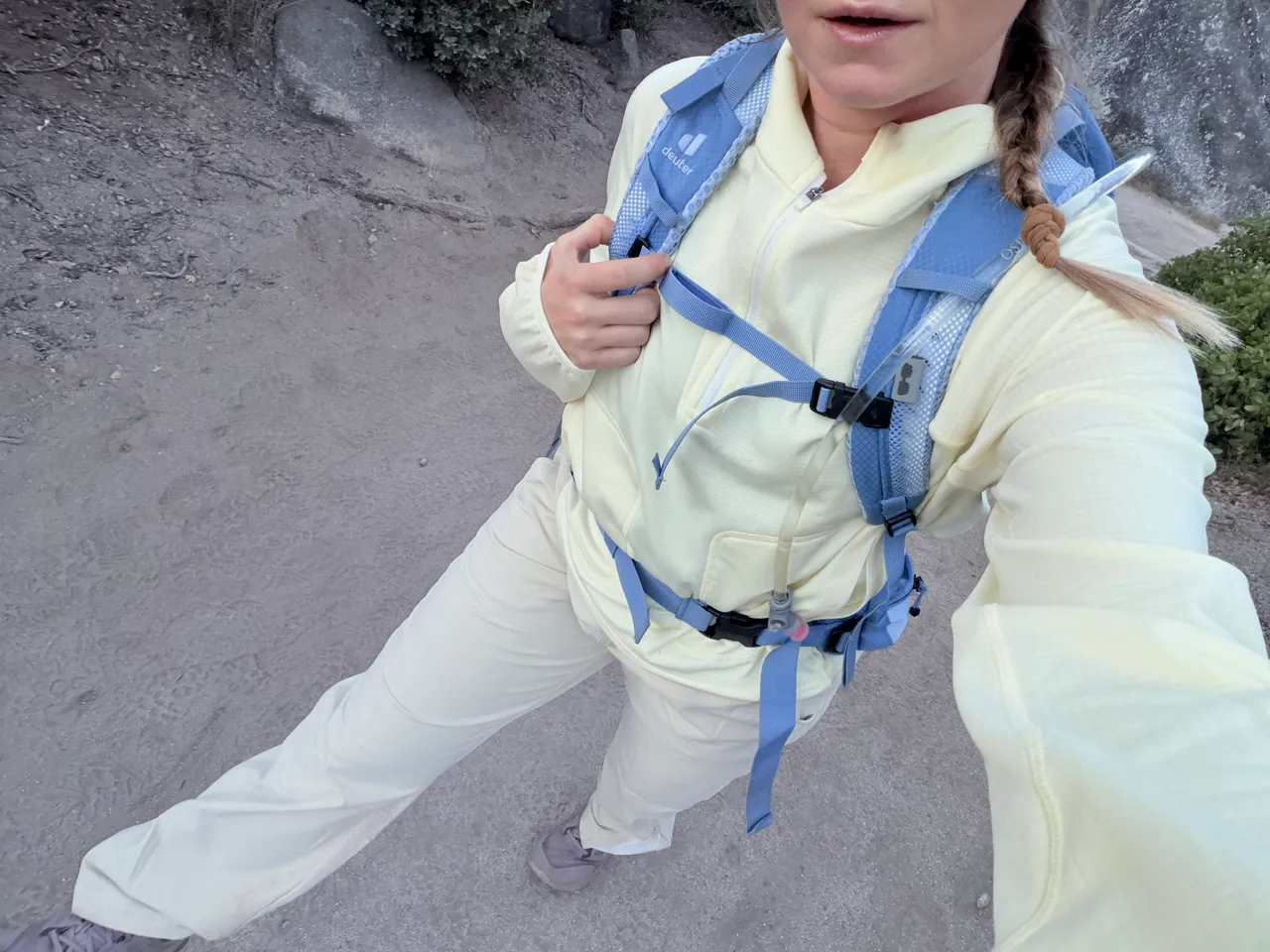My Half Dome trail outfit: a light sun hoodie, hiking pants, trail shoes, and a blue backpack